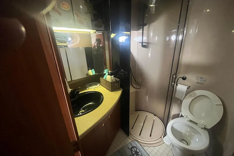 Slide: The Image of Bathroom interior of 2000 Cruisers Yachts 5000 Sedan Sport with shower and toilet. - 12