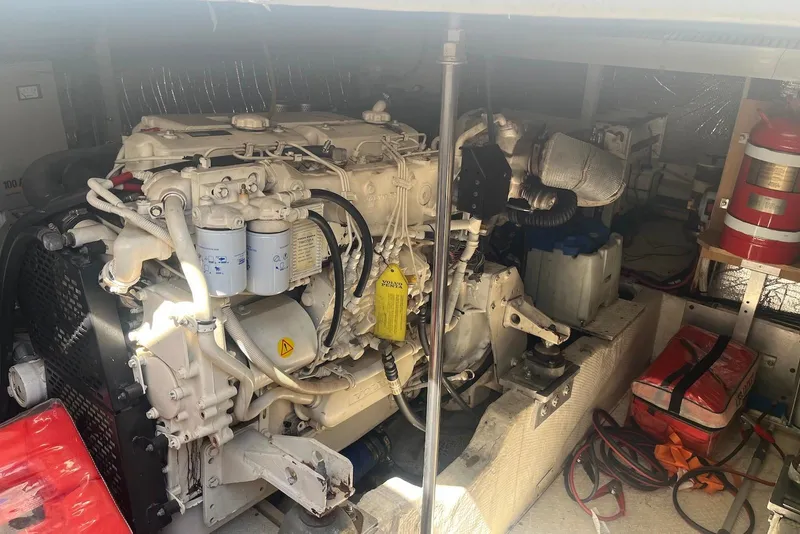 Slide: The Image of Engine room of 2000 Cruisers Yachts 5000 Sedan Sport with visible machinery and equipment. - 13