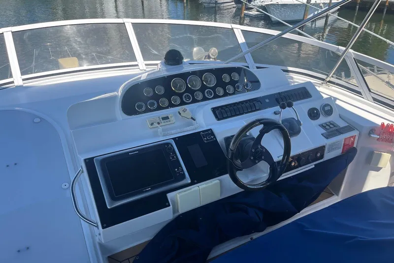 Slide: The Image of Helm of 2000 Cruisers Yachts 5000 Sedan Sport with navigation instruments and steering wheel. - 3