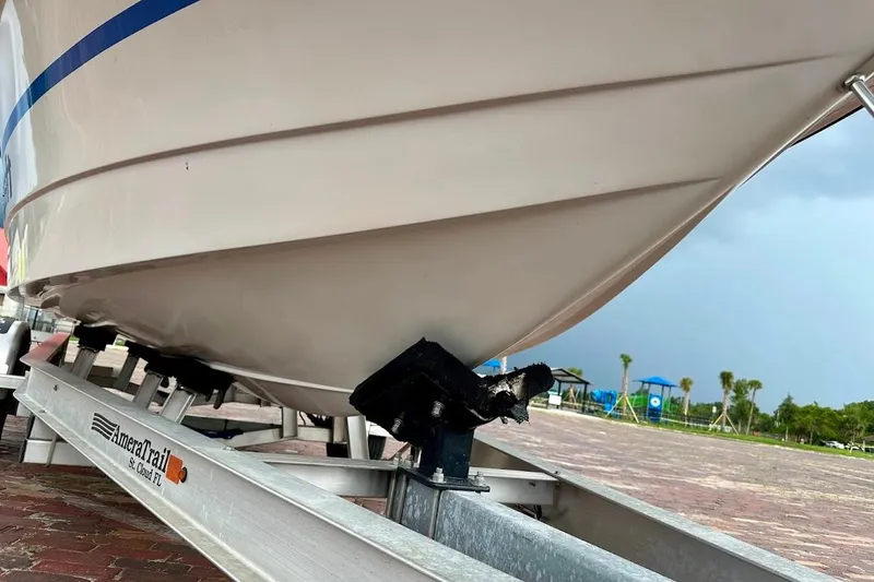 Slide: The Image of 1998 MasterCraft SportStar 19 boat on trailer, parked on brick pavement. - 10