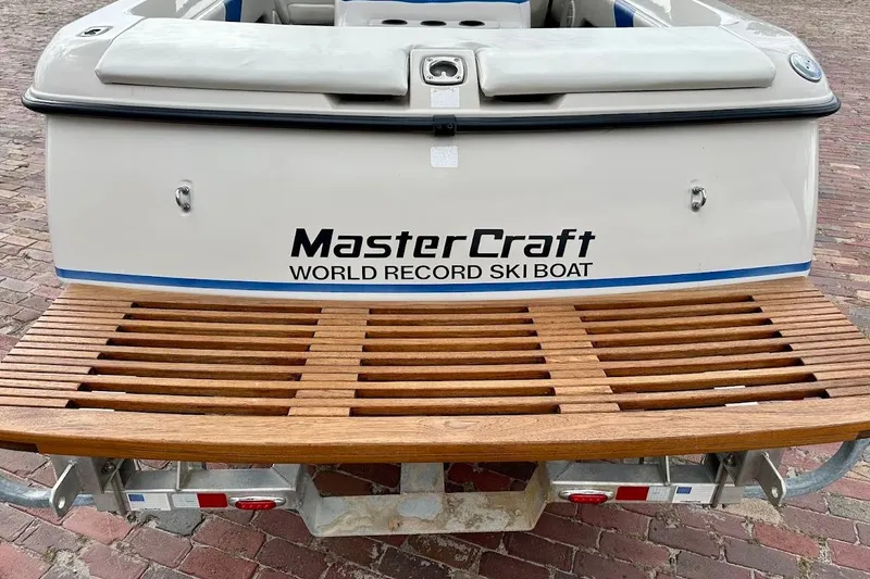 Slide: The Image of 1998 MasterCraft SportStar 19 ski boat with wooden swim platform. - 12