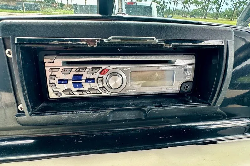 Slide: The Image of 1998 MasterCraft SportStar 19 dashboard with Clarion marine stereo system. - 23