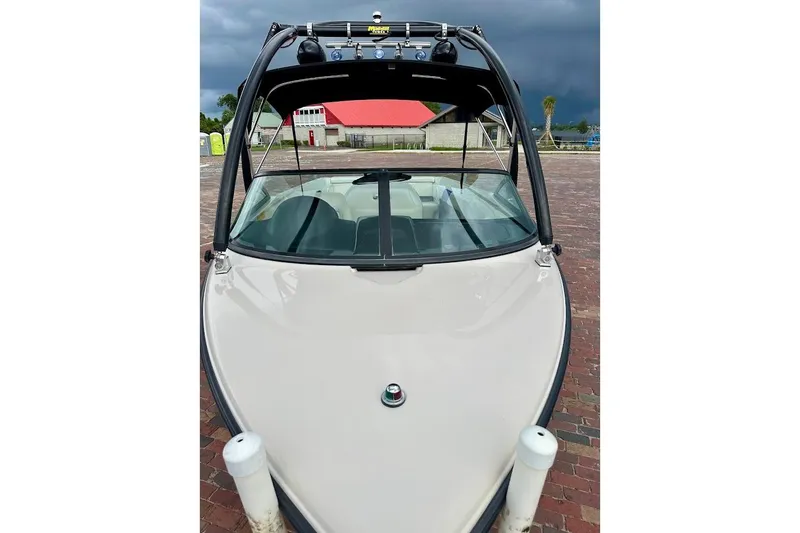 Slide: The Image of 1998 MasterCraft SportStar 19 boat with tower, parked on brick pavement. - 9