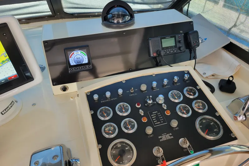 Slide: The Image of Control panel of a 1977 Hatteras 43 Double Cabin yacht with navigation instruments. - 25