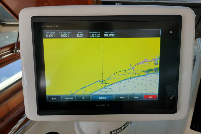 Slide: The Image of Garmin GPS display on 1977 Hatteras 43 Double Cabin, showing navigation data and map. - 27