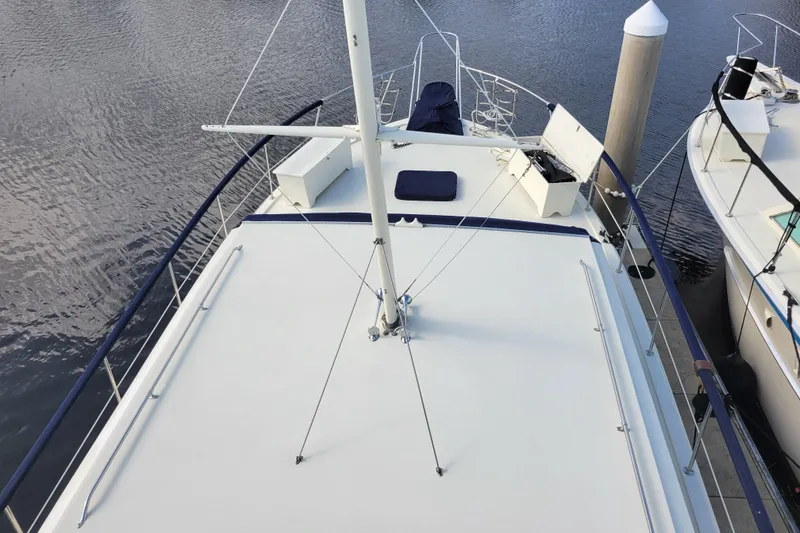 Slide: The Image of 1977 Hatteras 43 Double Cabin yacht deck view at marina. - 46