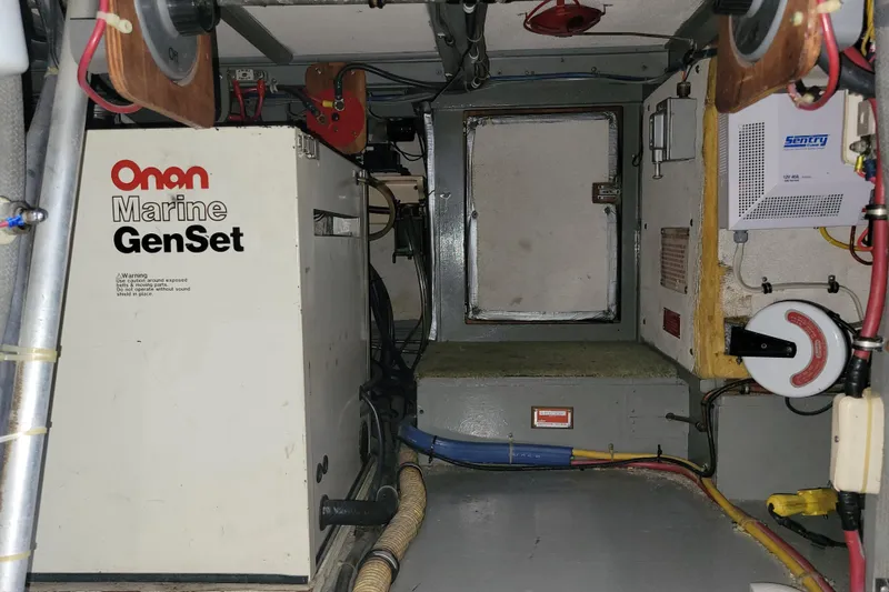 Slide: The Image of Engine room of 1977 Hatteras 43 Double Cabin with Onan Marine GenSet. - 48
