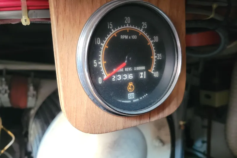 Slide: The Image of Tachometer of 1977 Hatteras 43 Double Cabin showing engine RPM and hours. - 53