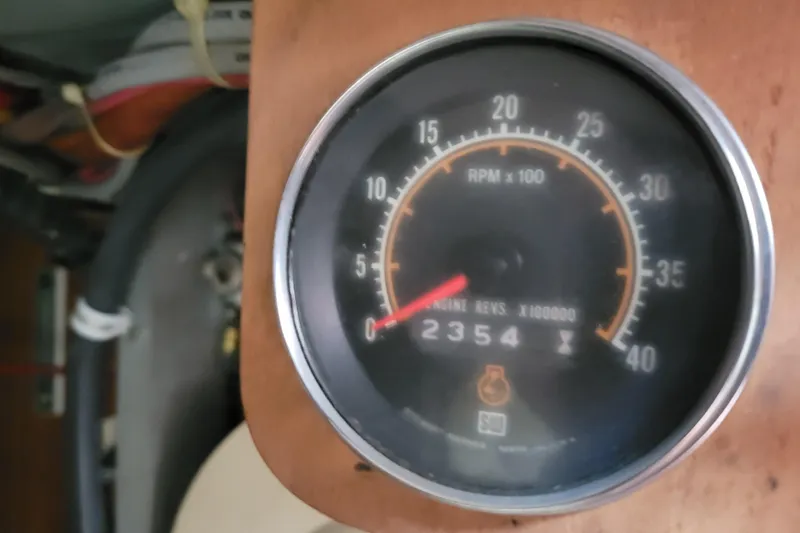 Slide: The Image of Tachometer of 1977 Hatteras 43 Double Cabin showing 2354 RPM. - 54