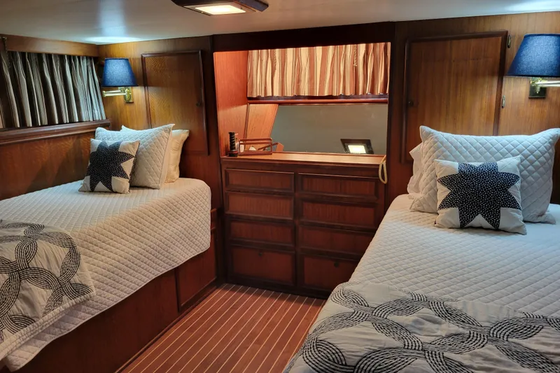 Slide: The Image of Cozy cabin interior of 1977 Hatteras 43 Double Cabin with twin beds and nautical decor. - 7