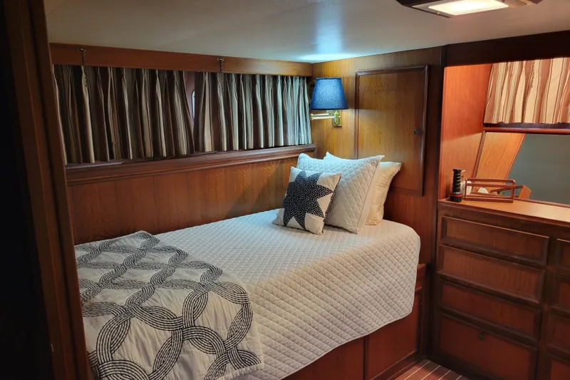 Slide: The Image of Cozy cabin interior of 1977 Hatteras 43 Double Cabin with bed and nautical decor. - 8