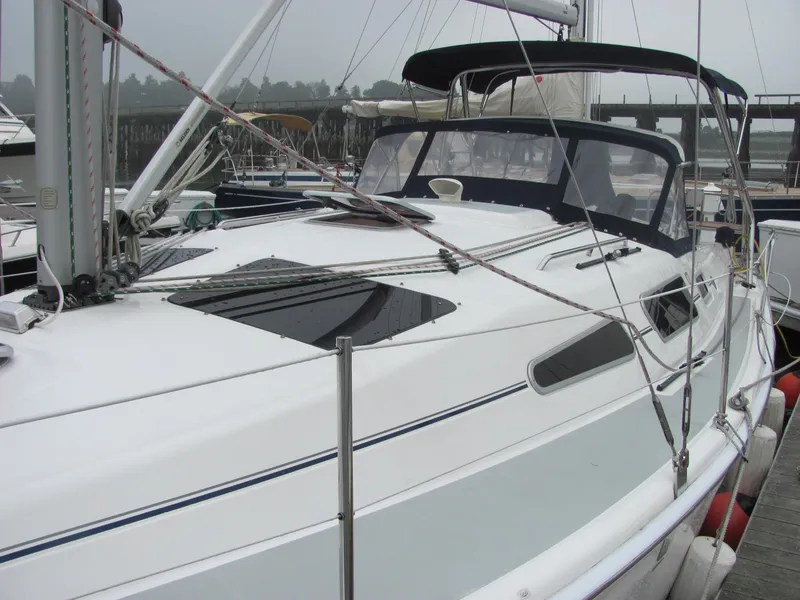 Slide: The Image of 2008 Hunter 33 sailboat docked at marina. - 10