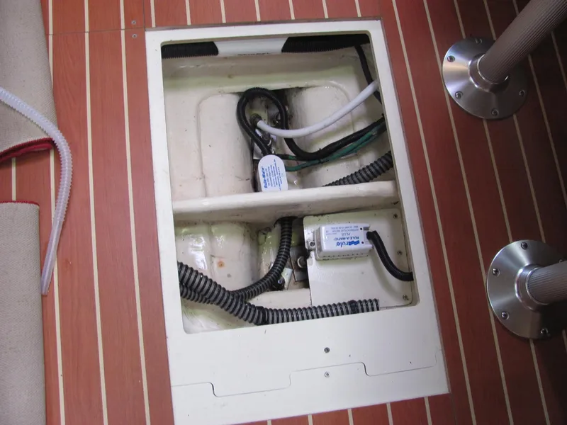 Slide: The Image of Interior of a 2008 Hunter 33 boat showing cables and pipes. - 11