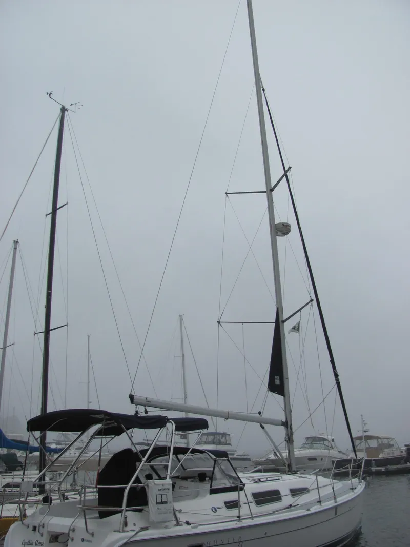 Slide: The Image of 2008 Hunter 33 sailboat in foggy harbor. - 2