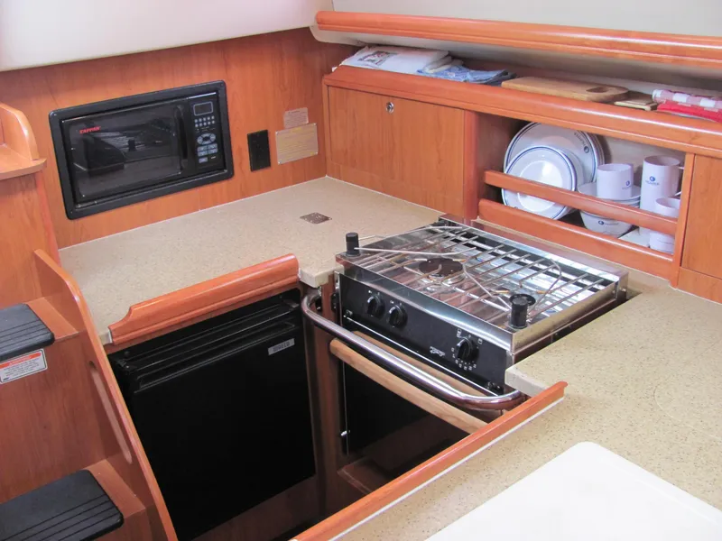 Slide: The Image of Galley of a 2008 Hunter 33 yacht with stove and microwave. - 3