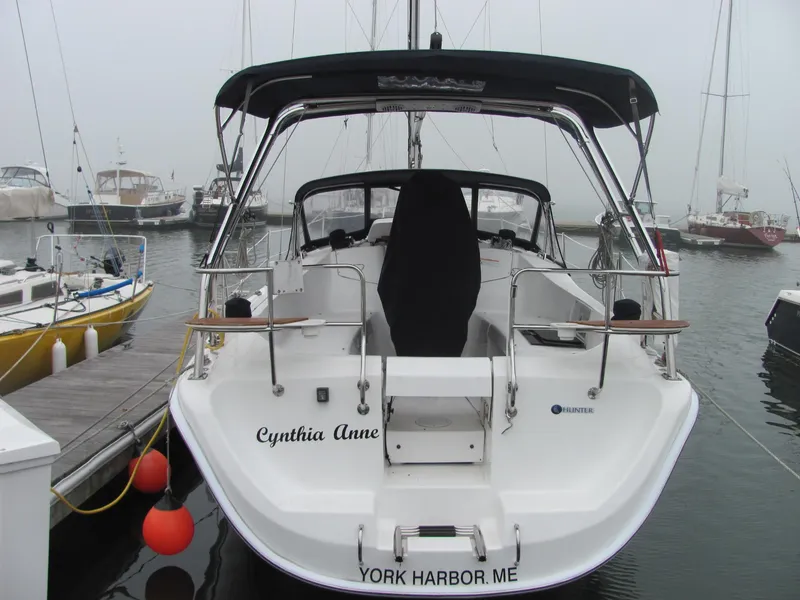 Slide: The Image of Rear view of a 2008 Hunter 33 sailboat docked in harbor. - 5