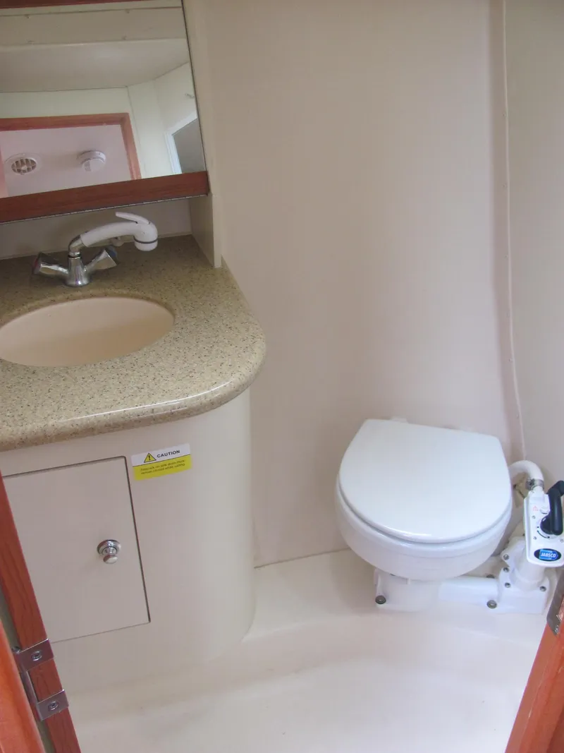 Slide: The Image of Bathroom in 2008 Hunter 33 sailboat with sink and toilet. - 7