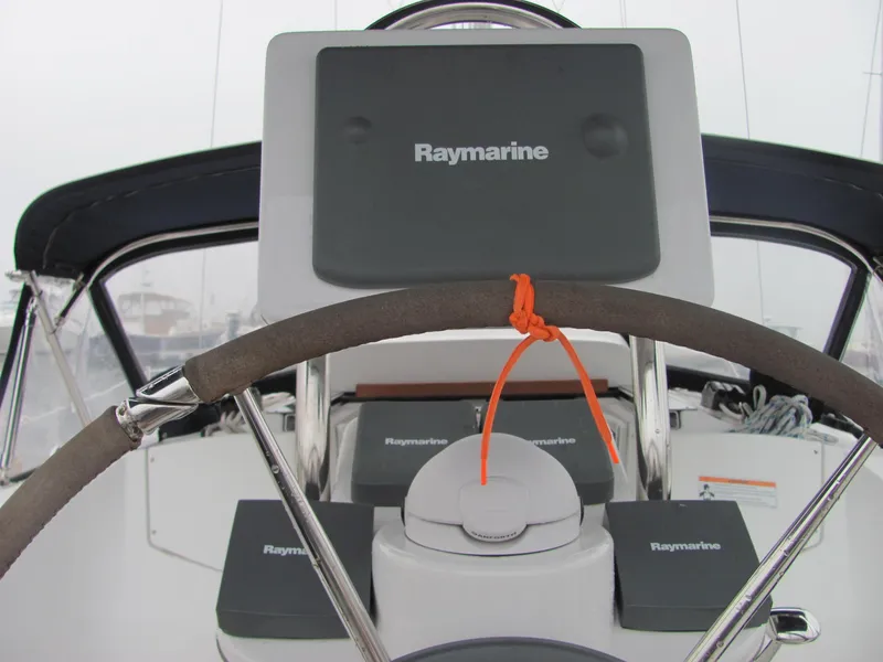 Slide: The Image of Steering wheel of a 2008 Hunter 33 yacht with Raymarine equipment. - 9