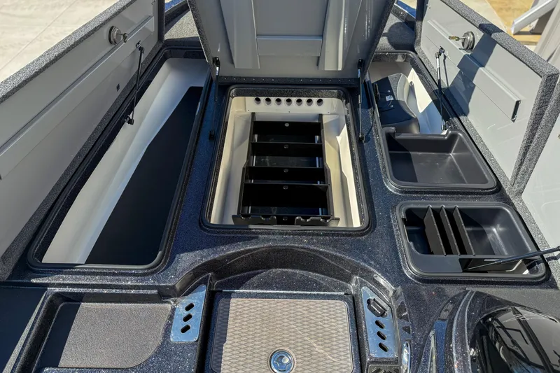 Slide: The Image of 2023 Caymas CX 21 PRO boat storage compartments and deck layout. - 12
