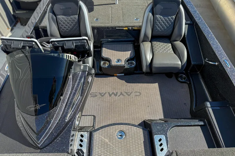 Slide: The Image of 2023 Caymas CX 21 PRO boat interior with dual seats and sleek dashboard design. - 13