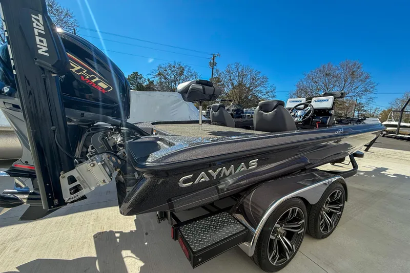 Slide: The Image of 2023 Caymas CX 21 PRO bass boat with dual consoles and powerful outboard motor. - 4