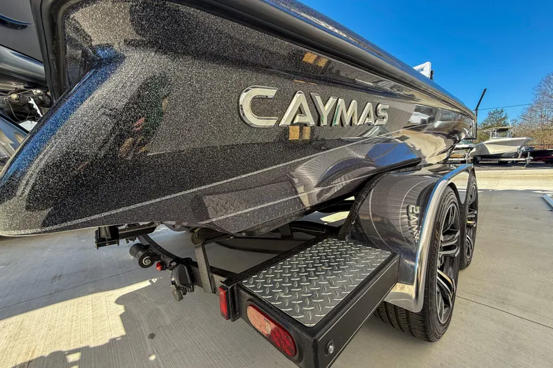 Slide: The Image of 2023 Caymas CX 21 PRO boat on trailer, showcasing sleek design and metallic finish. - 5