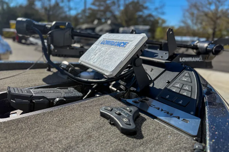 Slide: The Image of 2023 Caymas CX 21 PRO boat dashboard with Lowrance electronics and control panel. - 8