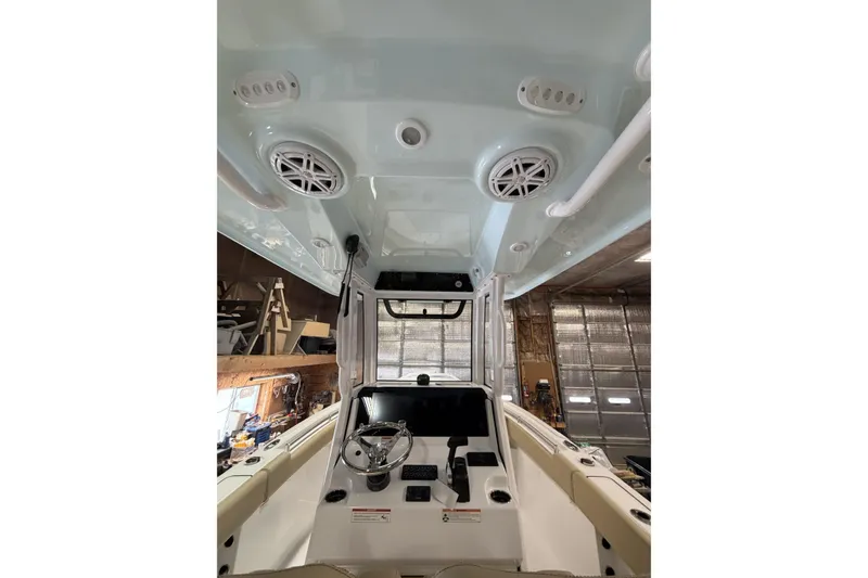 Slide: The Image of 2026 Sportsman Heritage 231 Center Console interior with steering wheel and overhead speakers. - 15
