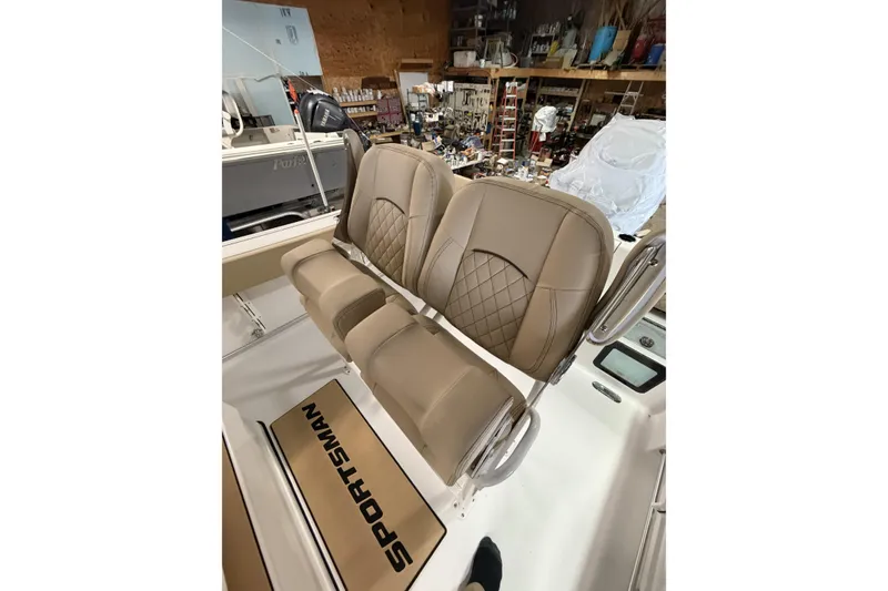 Slide: The Image of 2026 Sportsman Heritage 231 Center Console boat seats in a workshop setting. - 7