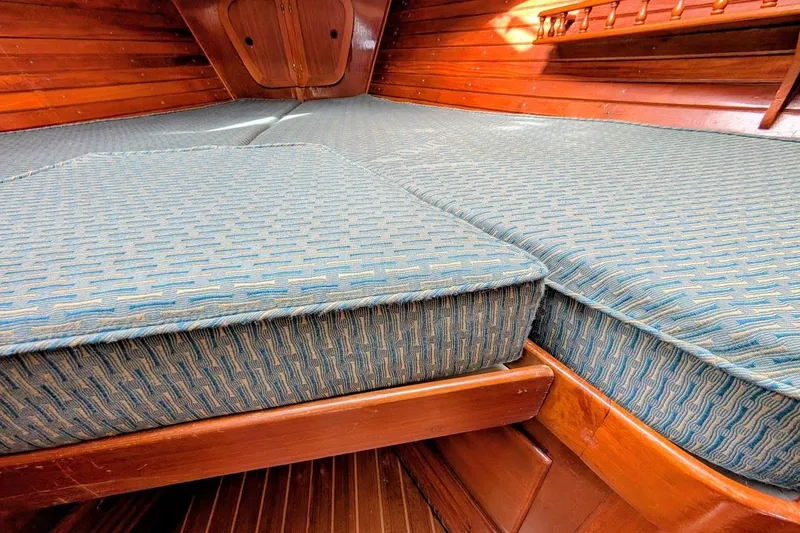 Slide: The Image of Interior cabin view of 1980 Island Trader 38 sailboat with cushioned berth. - 20