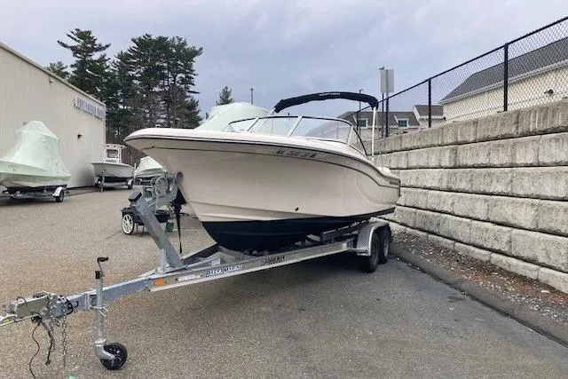 The Image of 2023 Grady-White Freedom 215 boat on trailer, parked outdoors. - 1
