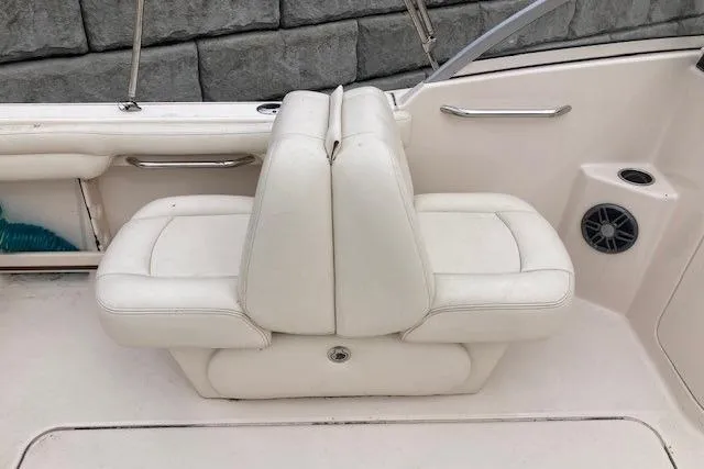 Slide: The Image of 2023 Grady-White Freedom 215 boat interior with white cushioned seating. - 7