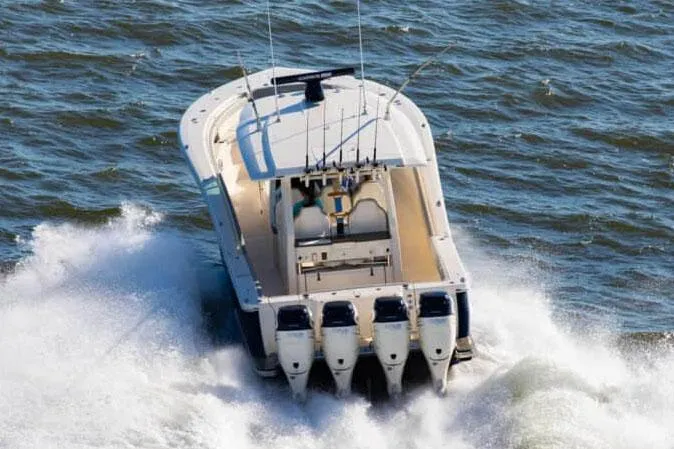 Slide: The Image of Manufacturer Provided Image: 2025 Scout 425 LXF boat cruising on open water with powerful engines. - 3
