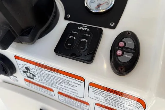 Slide: The Image of Control panel of a 2019 Mako 214 Center Console boat with warning labels. - 16