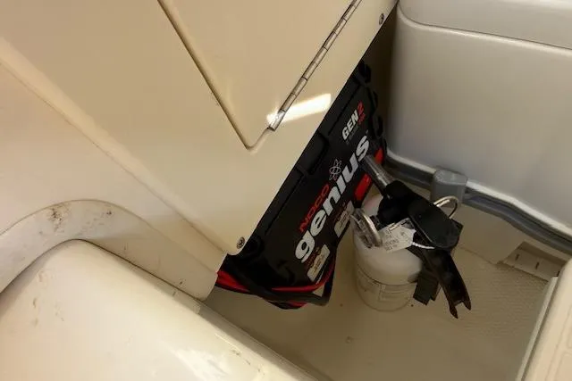 Slide: The Image of 2019 Mako 214 Center Console boat with Noco Genius GEN2 battery charger. - 19