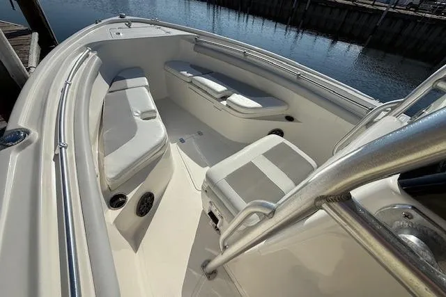 Slide: The Image of 2019 Mako 214 Center Console boat interior with seating and railings. - 21
