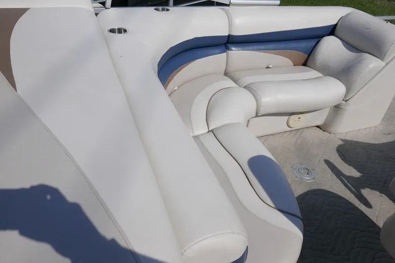 Slide: The Image of Luxurious seating on a 2009 Manitou 20 Encore pontoon boat with cup holders. - 10