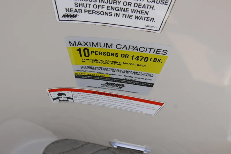 Slide: The Image of 2009 Manitou 20 Encore capacity label: 10 persons or 1470 lbs, 200 horsepower. - 12