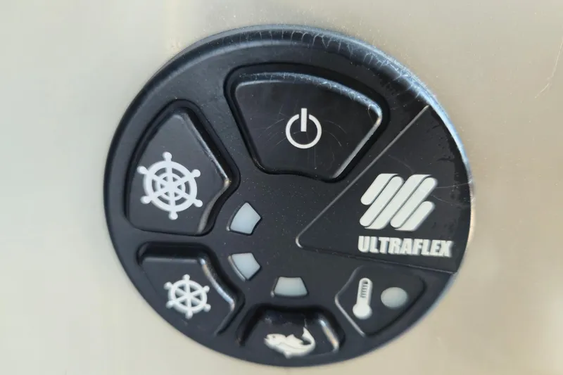 Slide: The Image of Ultraflex control panel on 2022 Barletta Cabrio 24UC boat, featuring various function icons. - 21