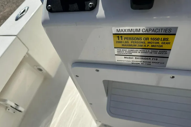 Slide: The Image of BayRider Kencraft 219 Bay 2022 boat capacity label, showing weight and passenger limits. - 10