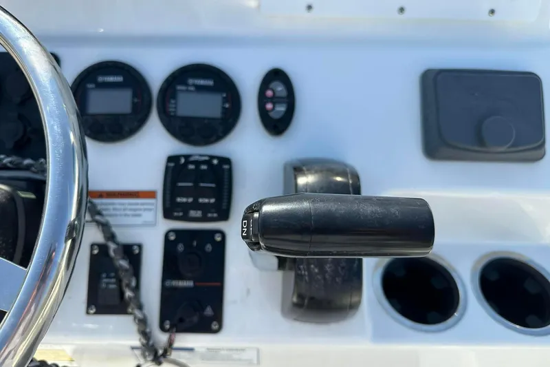 Slide: The Image of Control panel of 2022 BayRider Kencraft 219 Bay boat with steering wheel and gauges. - 11
