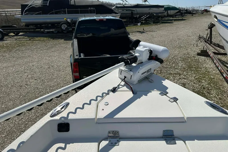 Slide: The Image of 2022 BayRider Kencraft 219 Bay boat with Minn Kota trolling motor in a marina. - 14