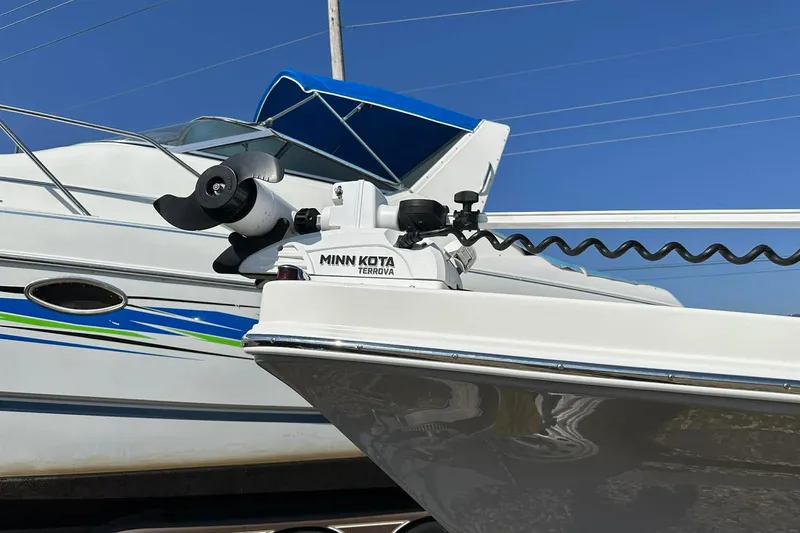 Slide: The Image of Minn Kota Terrova motor on 2022 BayRider Kencraft 219 Bay boat, clear sky background. - 2
