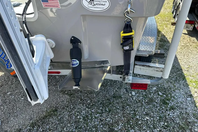 Slide: The Image of BayRider Kencraft 219 Bay 2022 boat trailer with accessories and American flag sticker. - 22