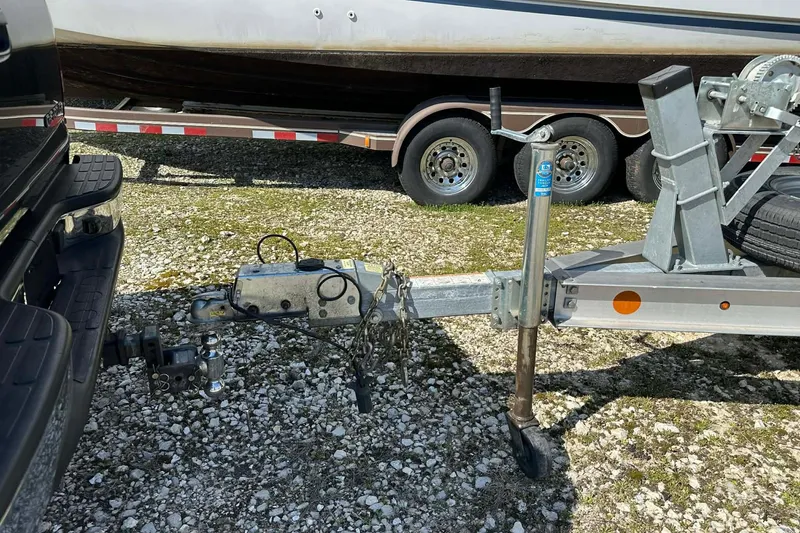 Slide: The Image of Trailer hitch connection for 2022 BayRider Kencraft 219 Bay boat on gravel surface. - 24