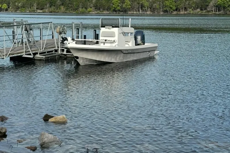 Slide: The Image of 2022 BayRider Kencraft 219 Bay boat docked on a serene lake. - 27