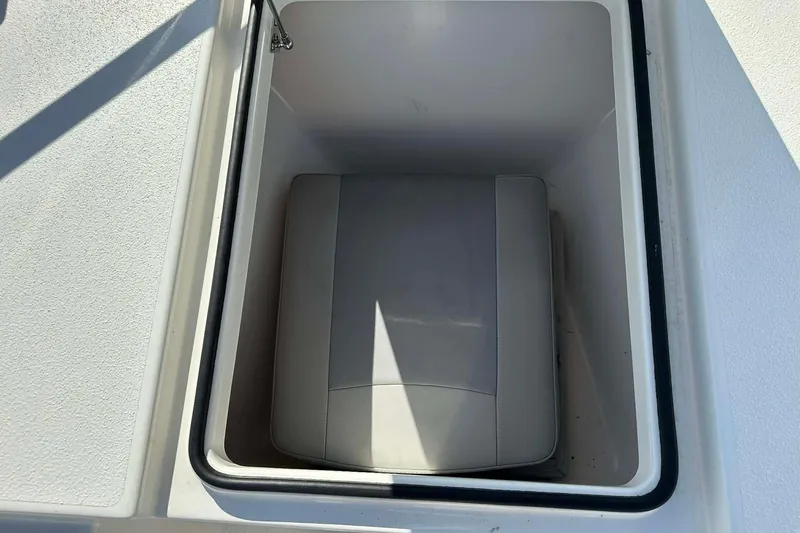Slide: The Image of Storage compartment on 2022 BayRider Kencraft 219 Bay boat, featuring cushioned interior. - 28