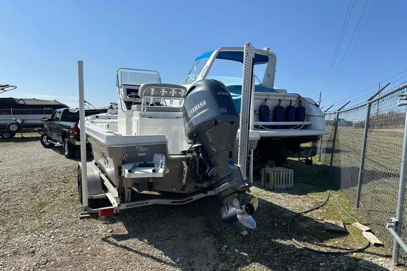 Slide: The Image of 2022 BayRider Kencraft 219 Bay boat with Yamaha motor on trailer in storage yard. - 33