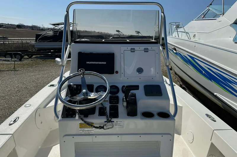 Slide: The Image of 2022 BayRider Kencraft 219 Bay boat console with steering wheel and controls. - 37