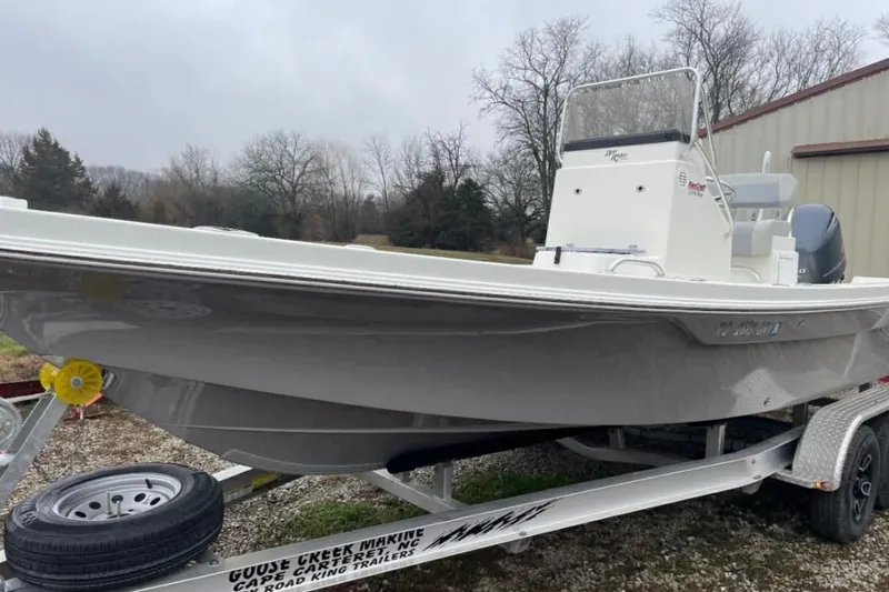 Slide: The Image of 2022 BayRider Kencraft 219 Bay boat on trailer, parked outdoors. - 40